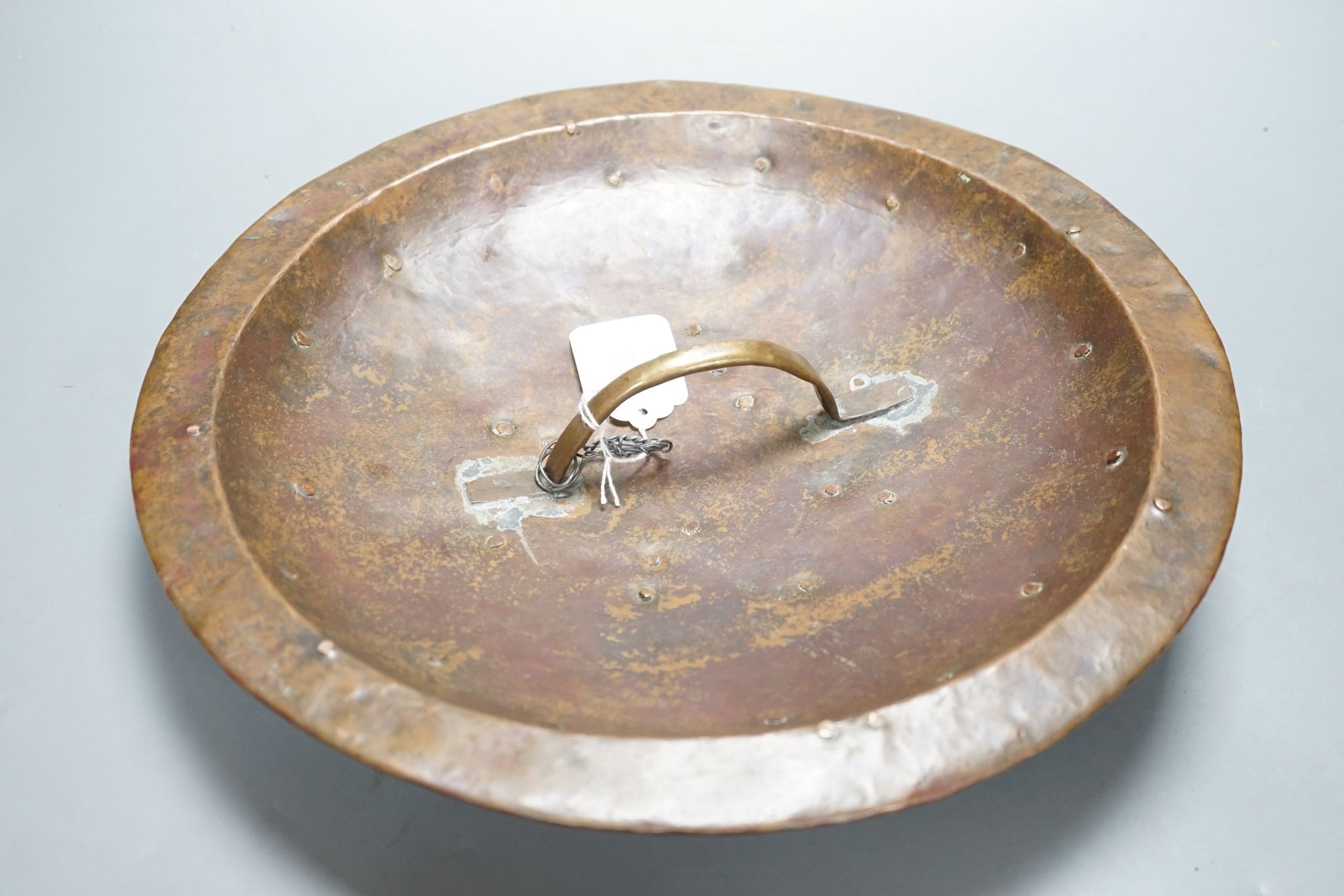 A Persian circular copper shield, 35.5 cms diameter.